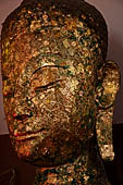 Ayutthaya, Thailand. Viharn Phra Mongkhon Bophit, Buddha heads covered in gold leaves.